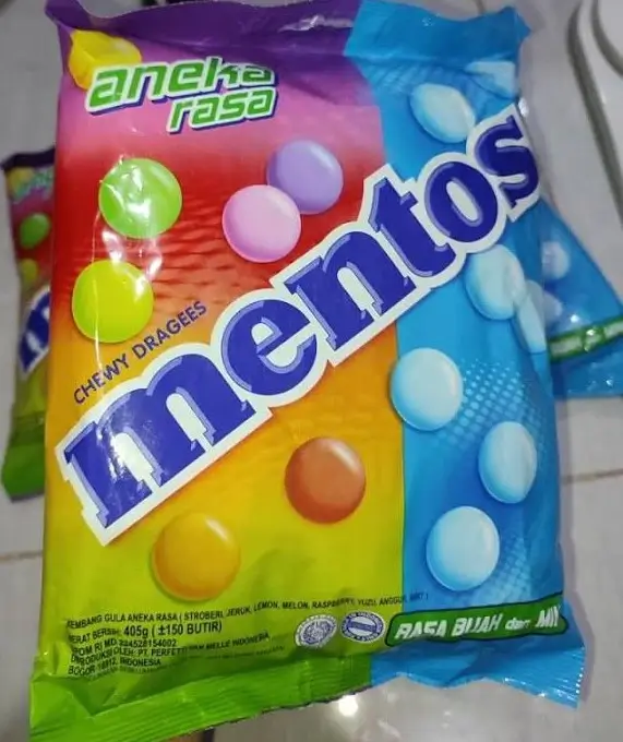 Mentos chewy dragees aneka rasa mixed fruits and mint flavors in colorful packaging with round candy graphics