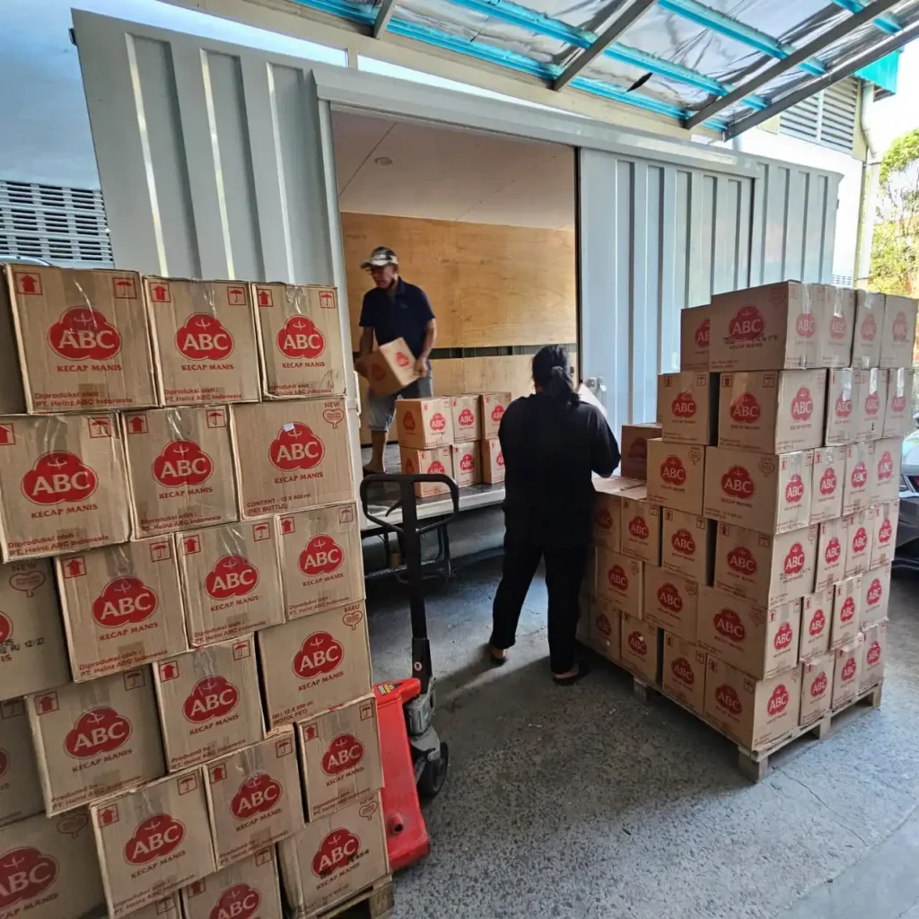 ABC sweet soy sauce inventory stacked boxes with loading operations Sinarmas Marketing