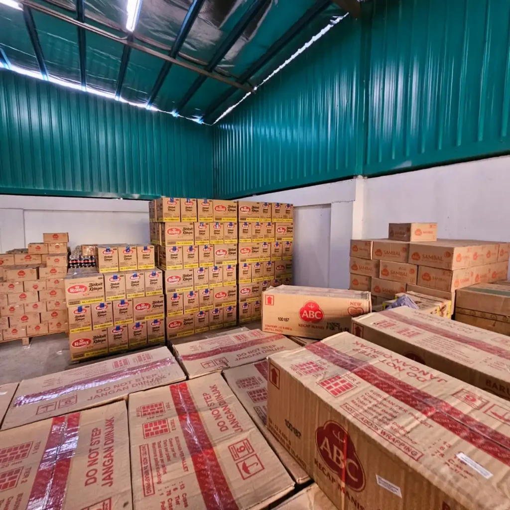 Industrial warehouse food product storage facility with organized inventory boxes by Sinarmas Marketing